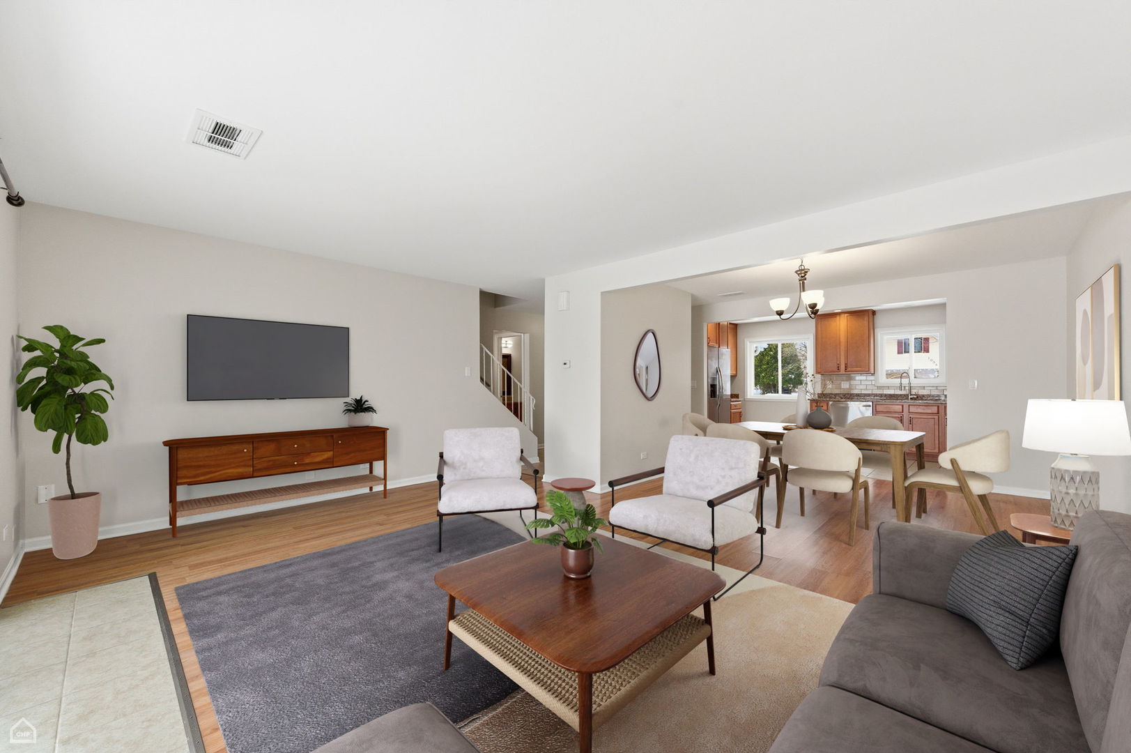 1081 Pinehurst Lane Schaumburg, IL 60193 - Photo 2 of 26 a living room with furniture and a potted plant
