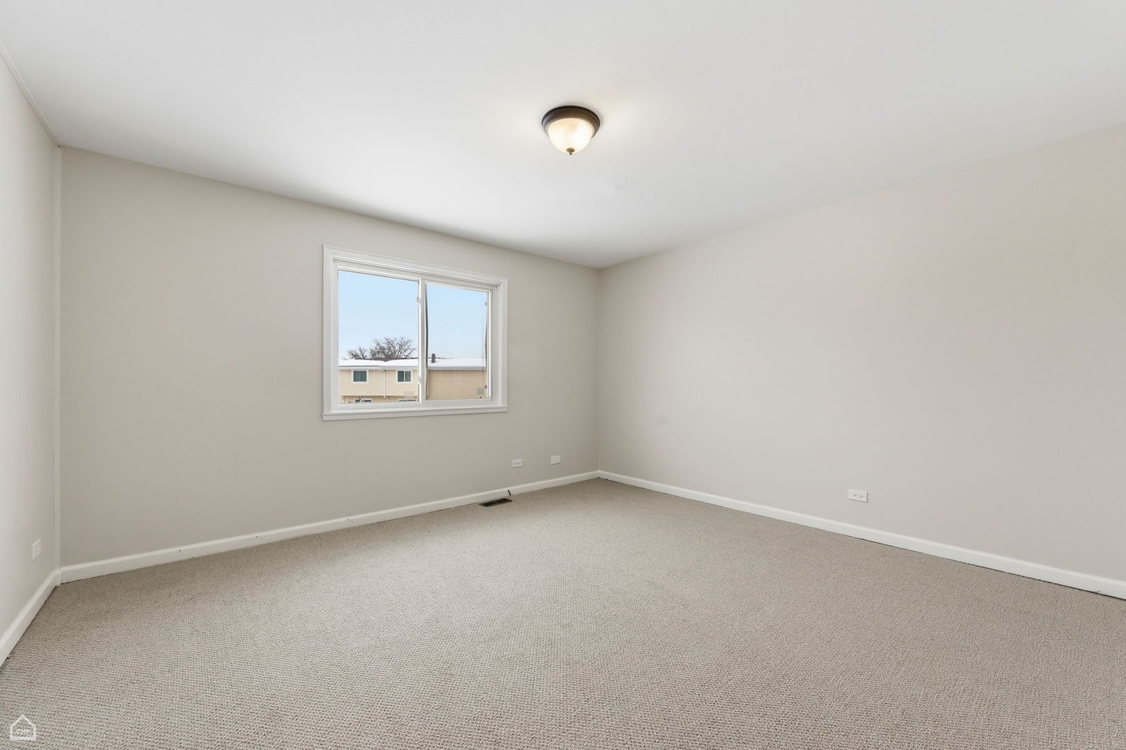 1081 Pinehurst Lane Schaumburg, IL 60193 - Photo 23 of 26 an empty room with a window