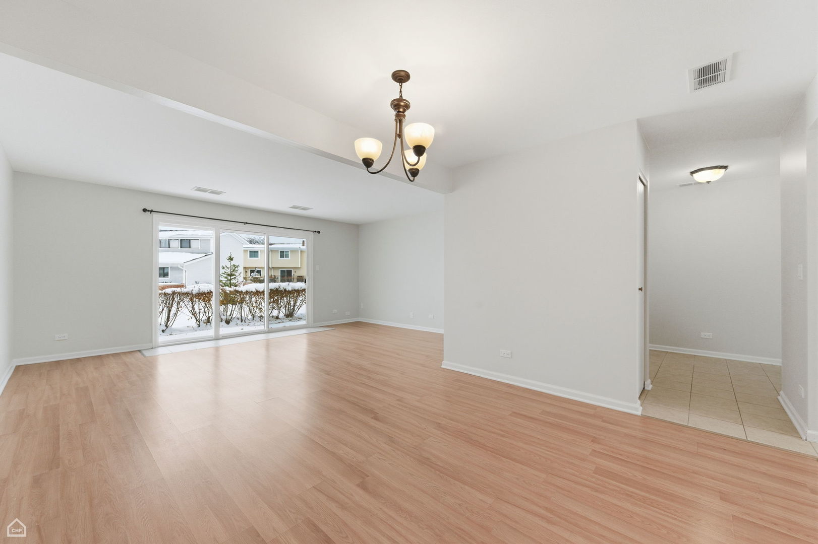 1081 Pinehurst Lane Schaumburg, IL 60193 - Photo 8 of 26 wooden floor in an empty room with a window