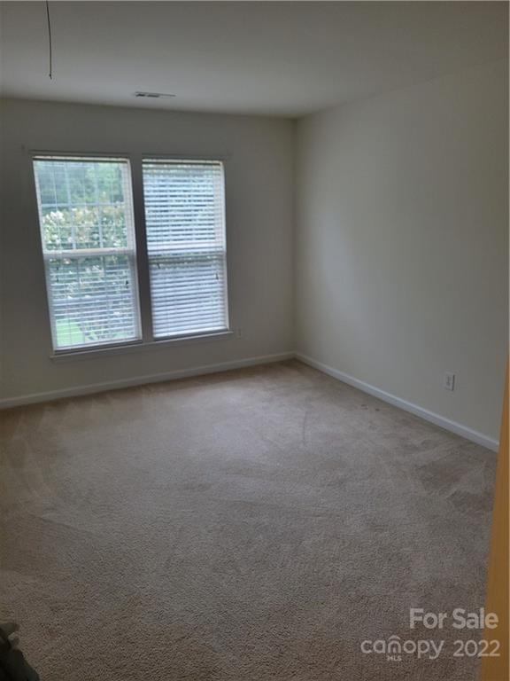 2449 Smith Cove Road Denver, NC 28037 - Photo 14 of 18 an empty room with a window