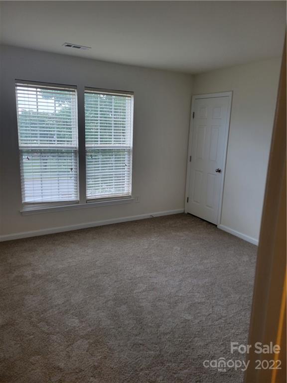 2449 Smith Cove Road Denver, NC 28037 - Photo 15 of 18 a view of an empty room with a window