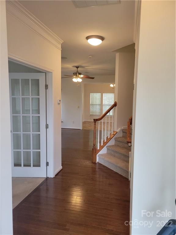 2449 Smith Cove Road Denver, NC 28037 - Photo 3 of 18 an empty room with wooden floor and windows