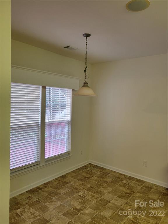 2449 Smith Cove Road Denver, NC 28037 - Photo 6 of 18 a view of empty room with windows
