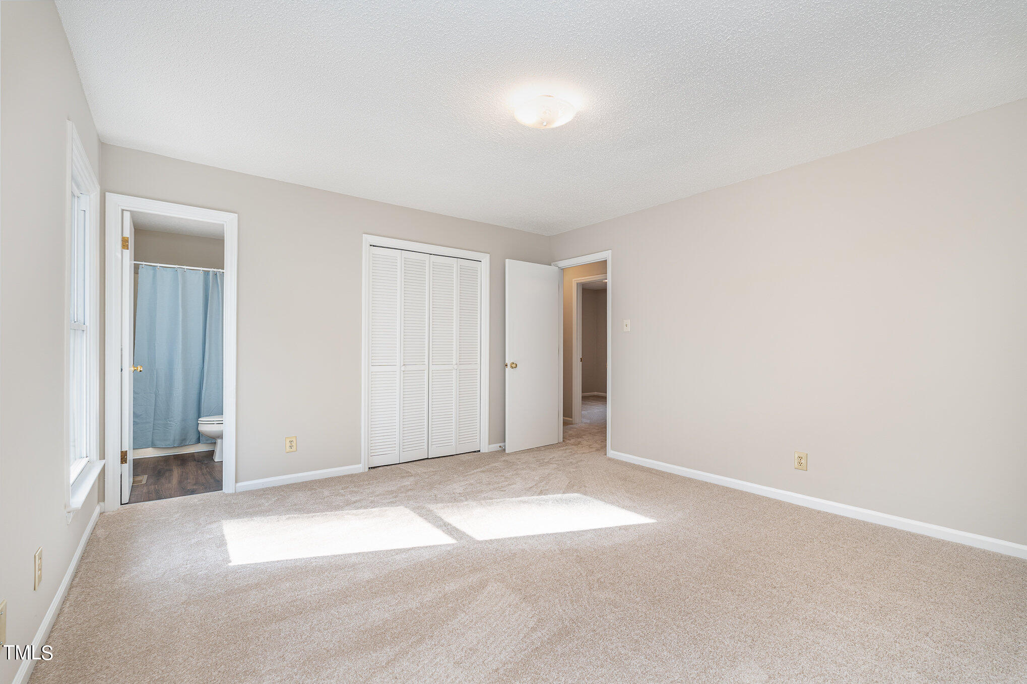 3703 Sandy Ridge Lane Durham, NC 27705 - Photo 16 of 36 an empty room with windows and closet