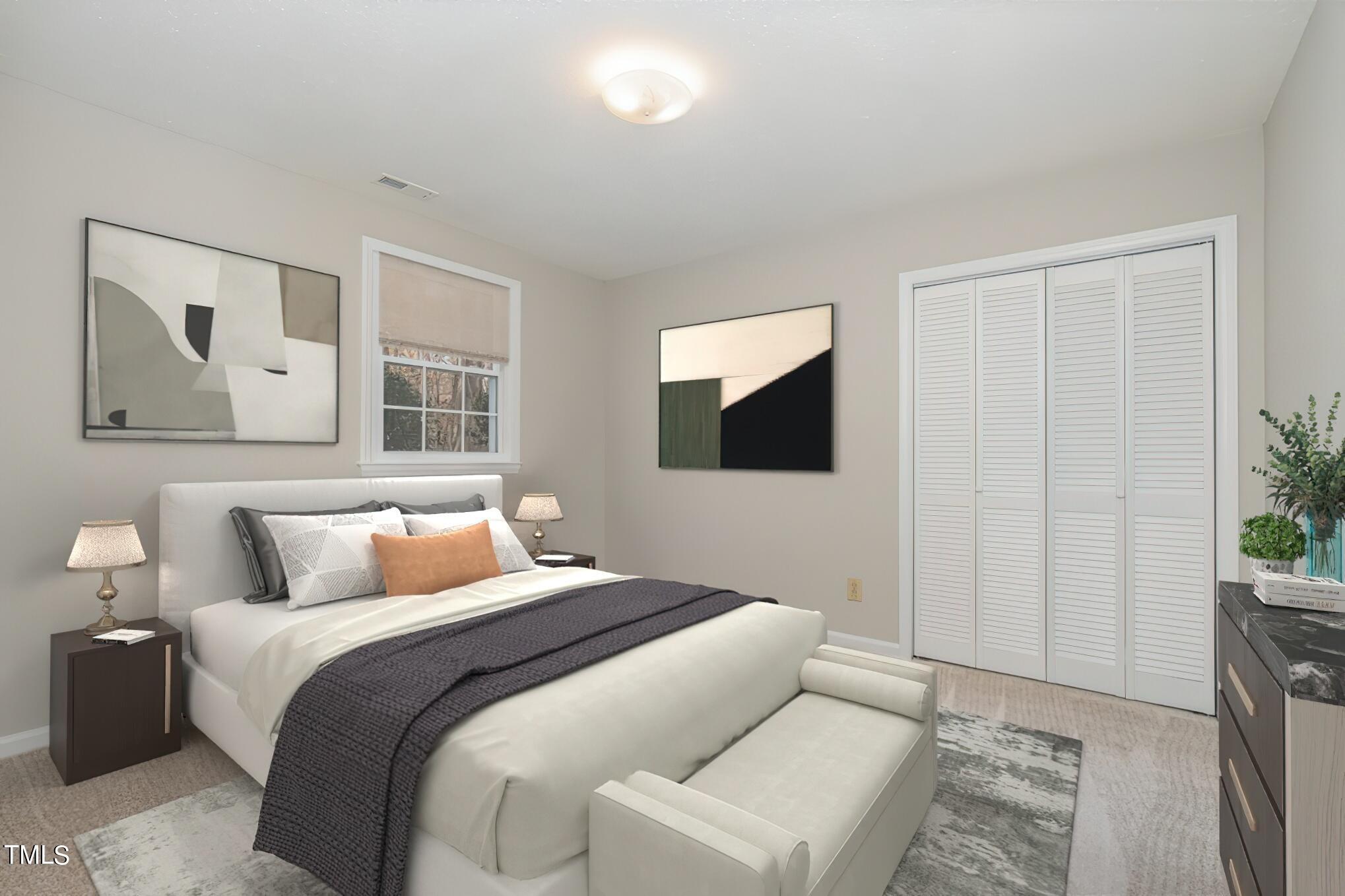 3703 Sandy Ridge Lane Durham, NC 27705 - Photo 23 of 36 a bedroom with a bed and a flat screen tv