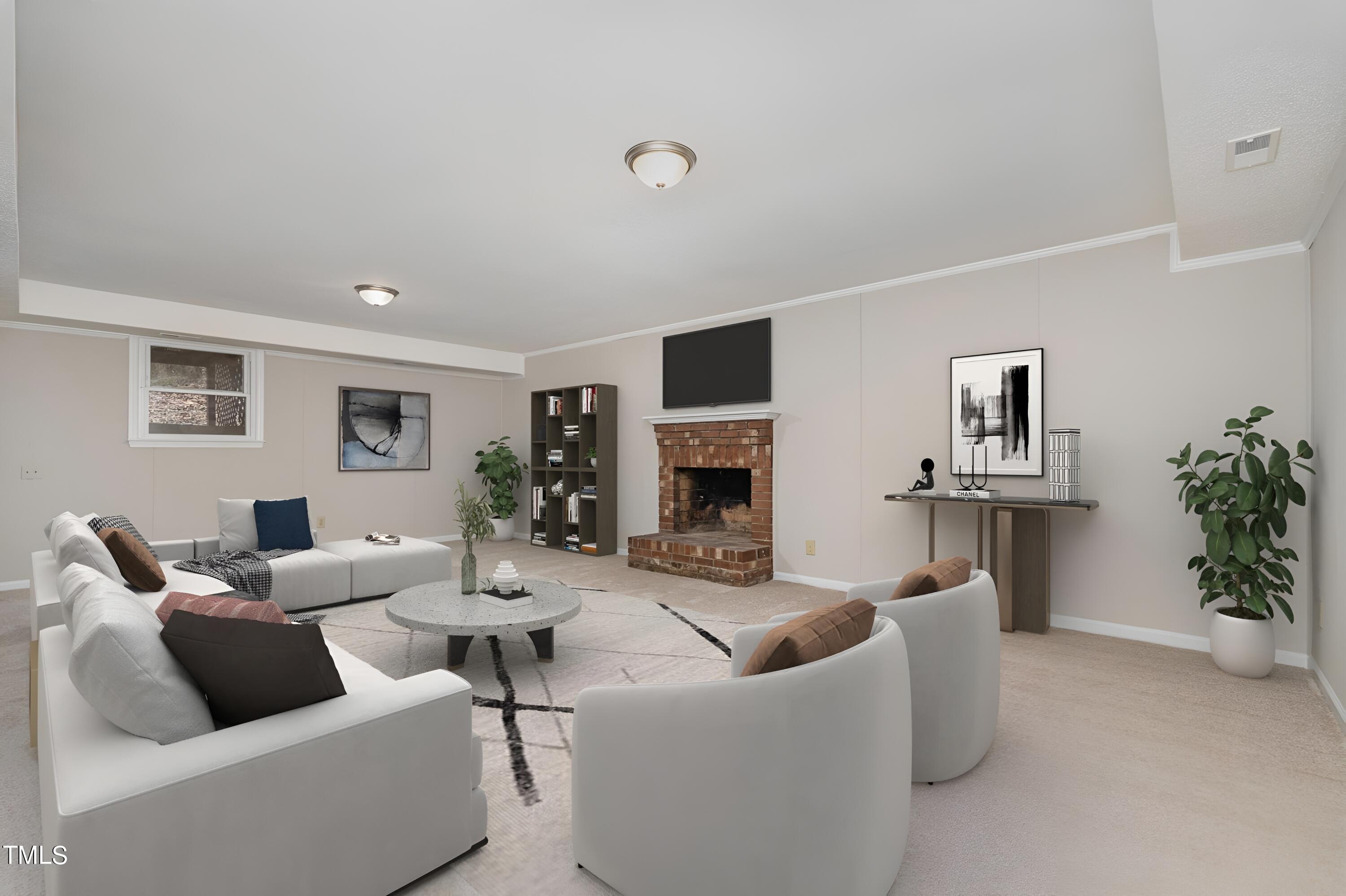 3703 Sandy Ridge Lane Durham, NC 27705 - Photo 29 of 36 a living room with furniture and a fireplace