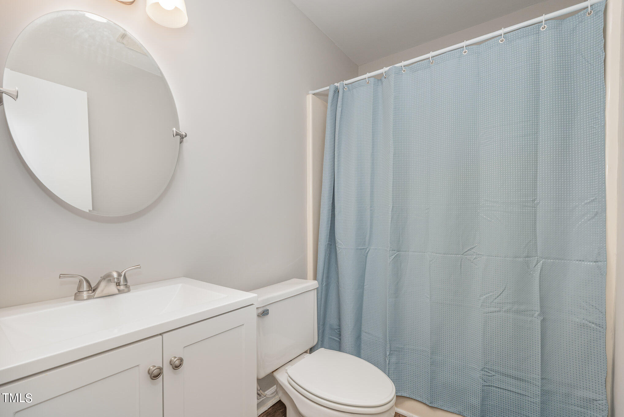 3703 Sandy Ridge Lane Durham, NC 27705 - Photo 30 of 36 a bathroom with a sink a toilet and shower
