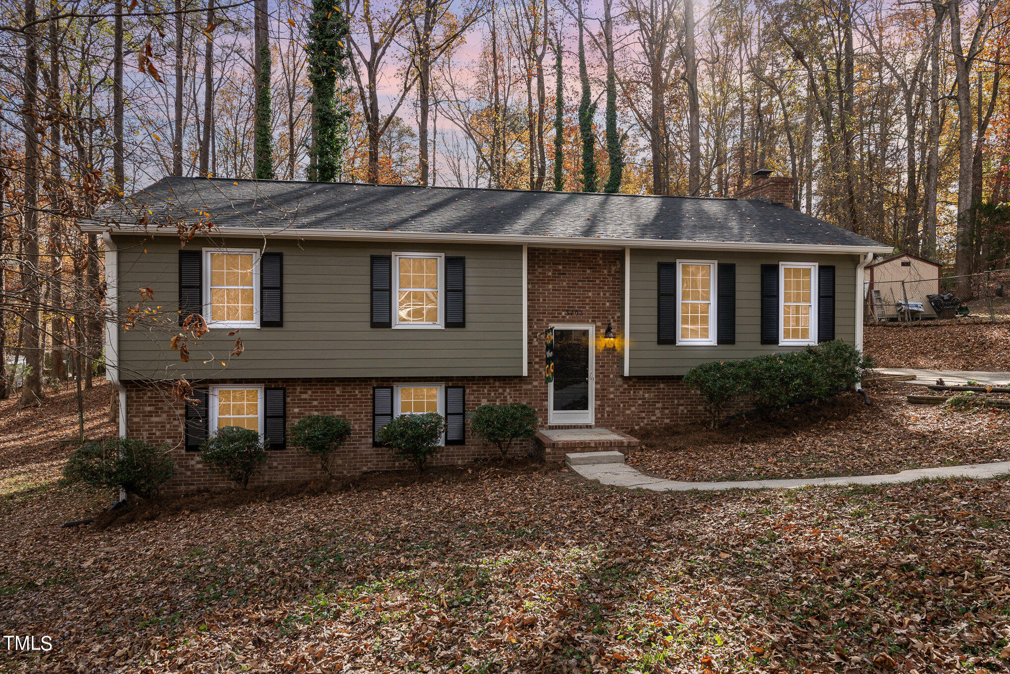3703 Sandy Ridge Lane Durham, NC 27705 - Photo 36 of 36 a front view of a house with garden