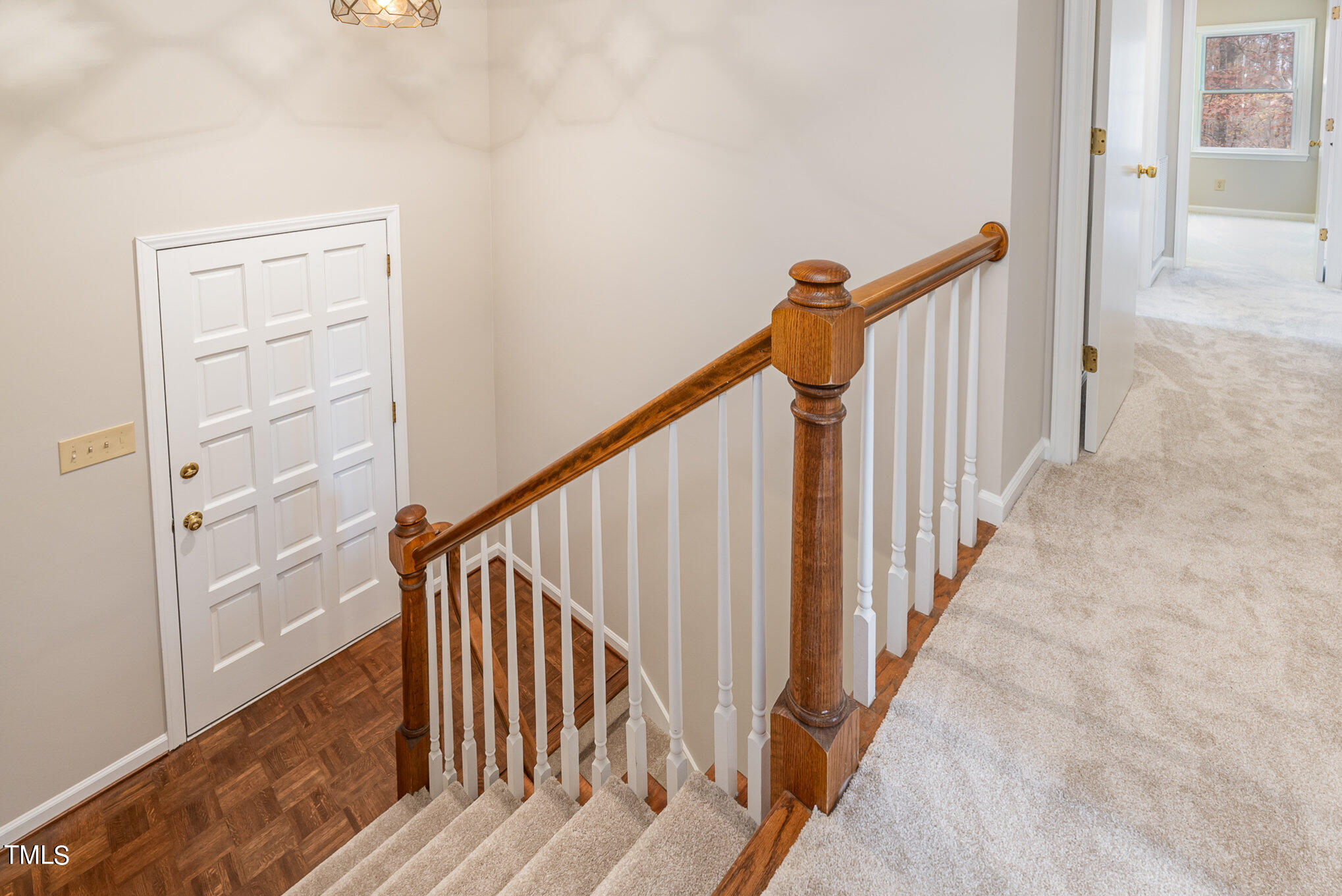 3703 Sandy Ridge Lane Durham, NC 27705 - Photo 4 of 36 a view of staircase with railing and white walls