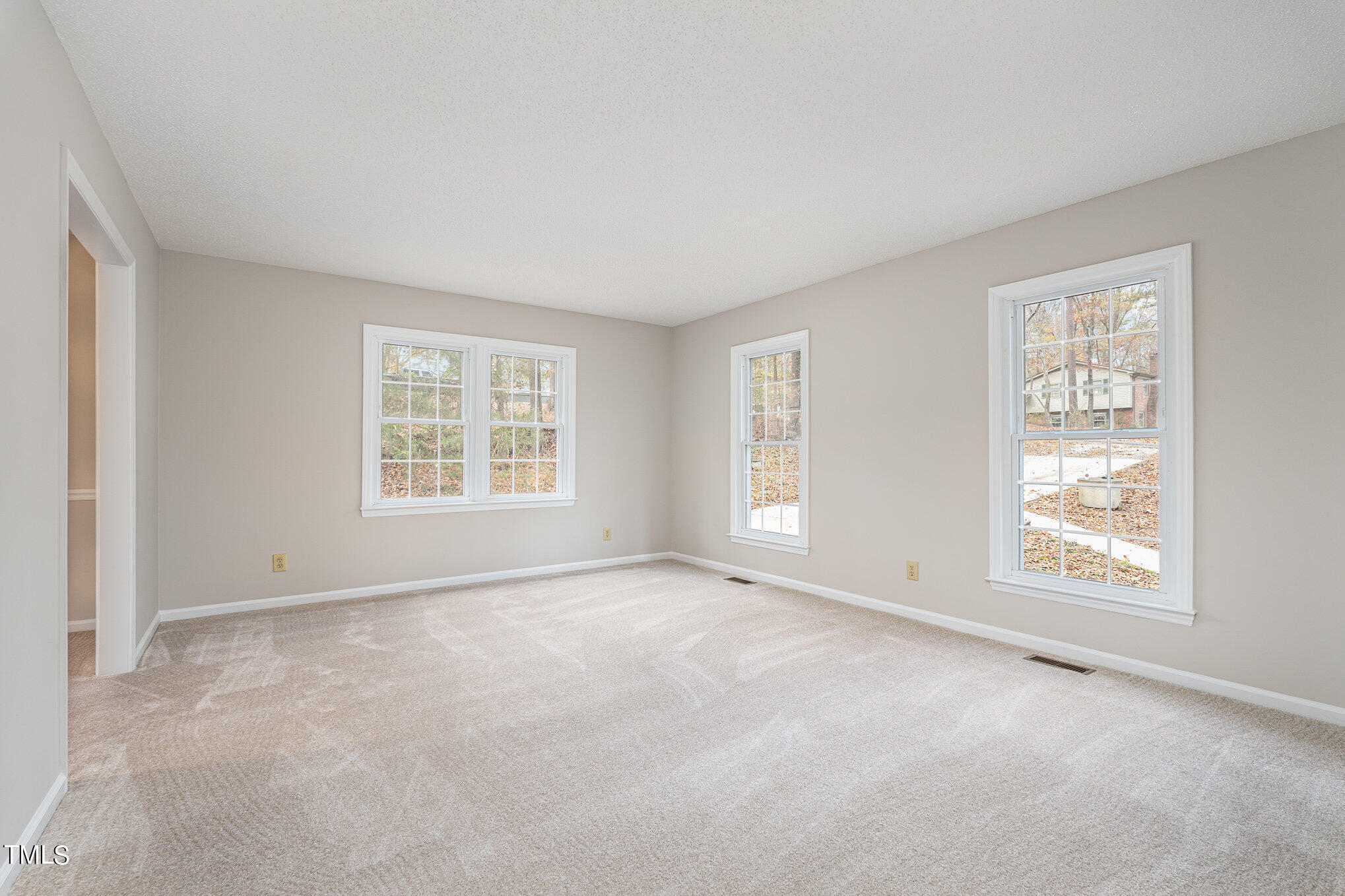 3703 Sandy Ridge Lane Durham, NC 27705 - Photo 5 of 36 an empty room with windows