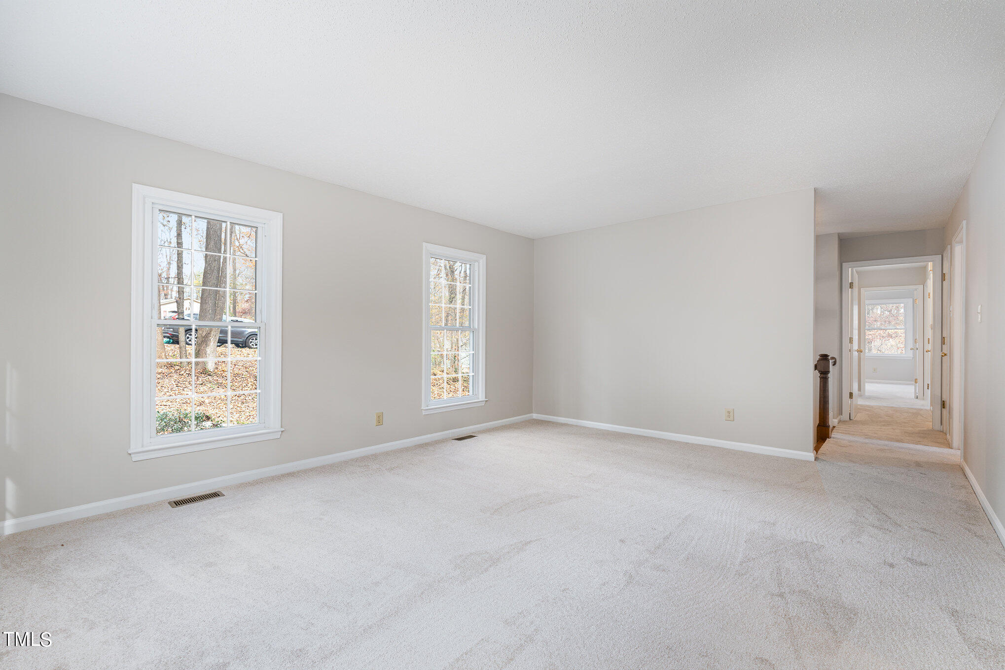 3703 Sandy Ridge Lane Durham, NC 27705 - Photo 7 of 36 an empty room with windows
