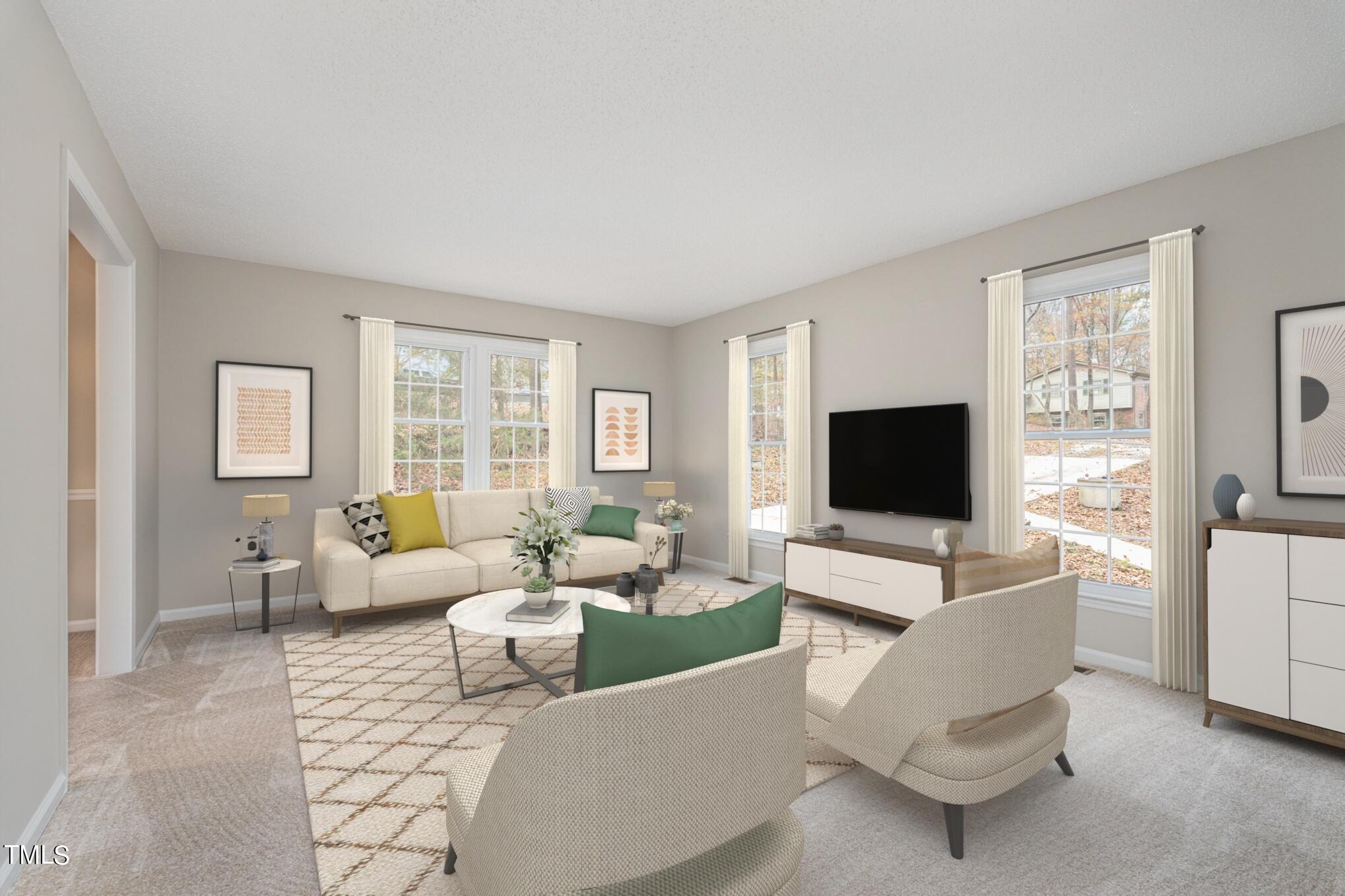 3703 Sandy Ridge Lane Durham, NC 27705 - Photo 8 of 36 a living room with furniture and a flat screen tv