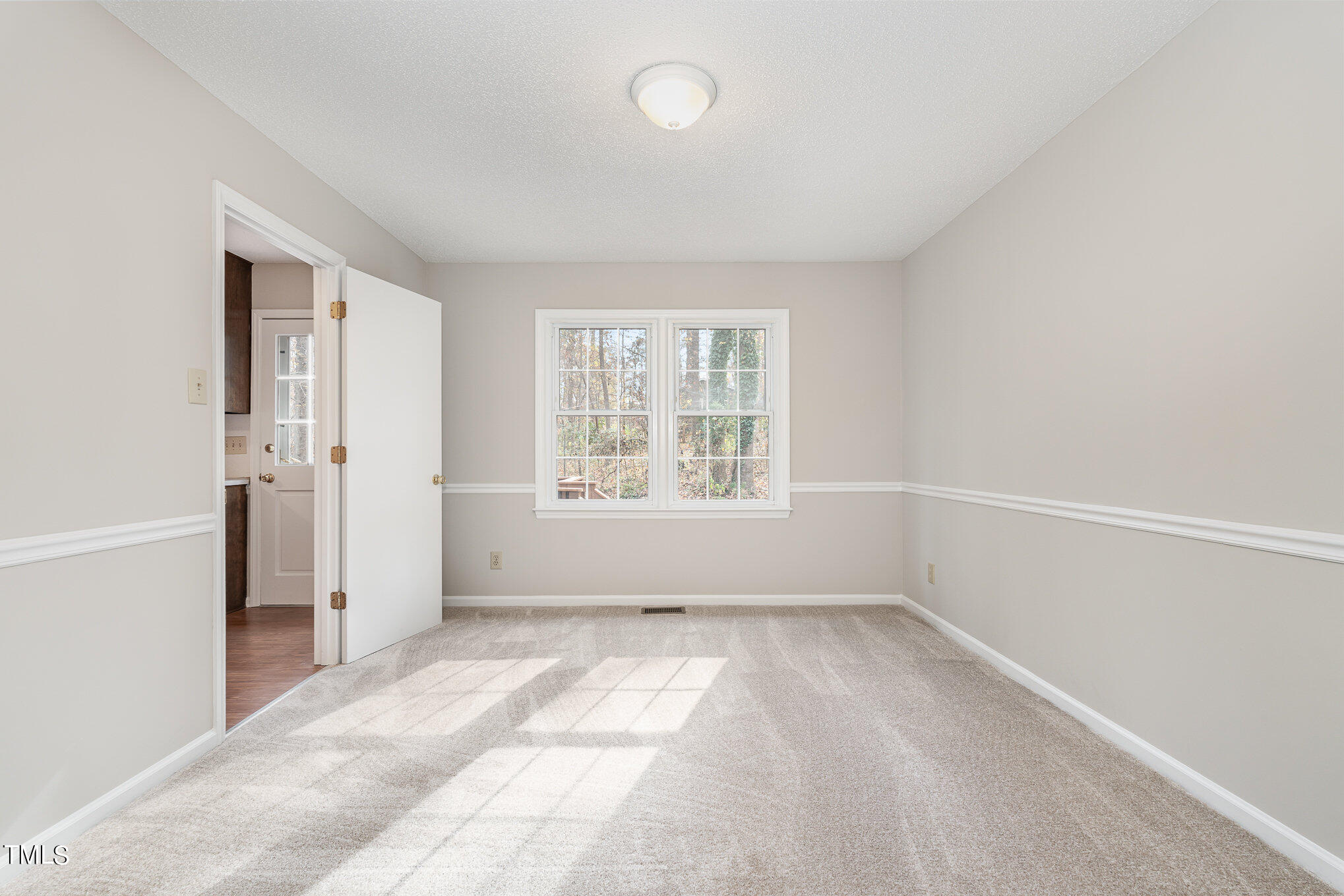 3703 Sandy Ridge Lane Durham, NC 27705 - Photo 9 of 36 an empty room with windows