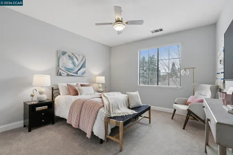 a bedroom with bed and a window