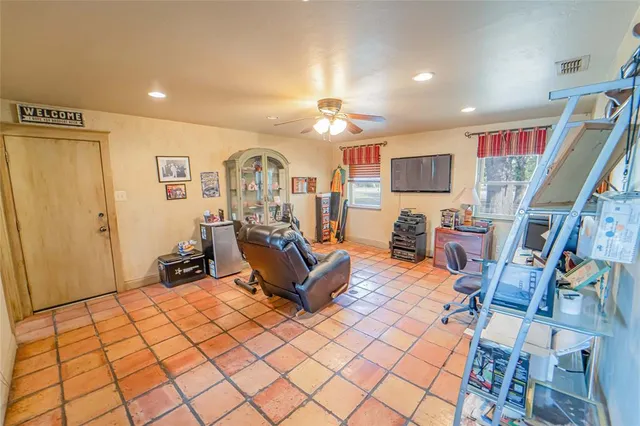 a bedroom with bed and a chandelier