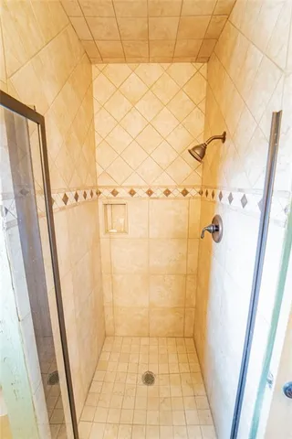 a bathroom with a sink mirror and a window