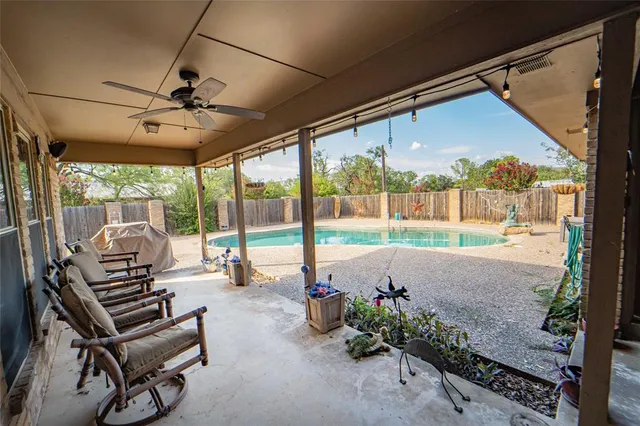 a house with swimming pool in front of it