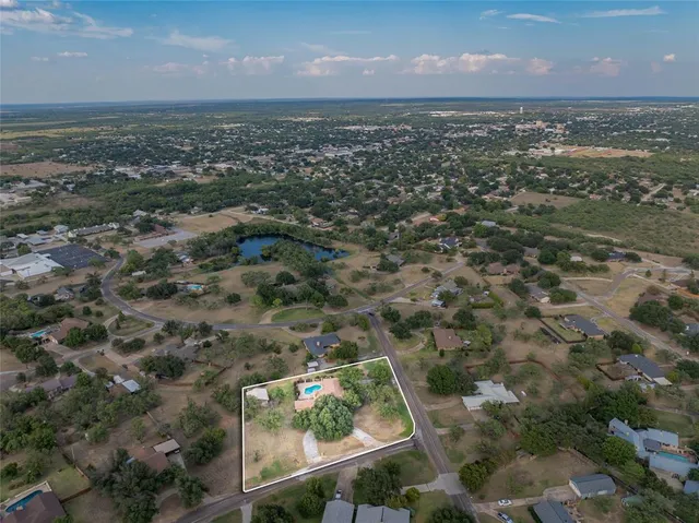 a view of a garden with houses