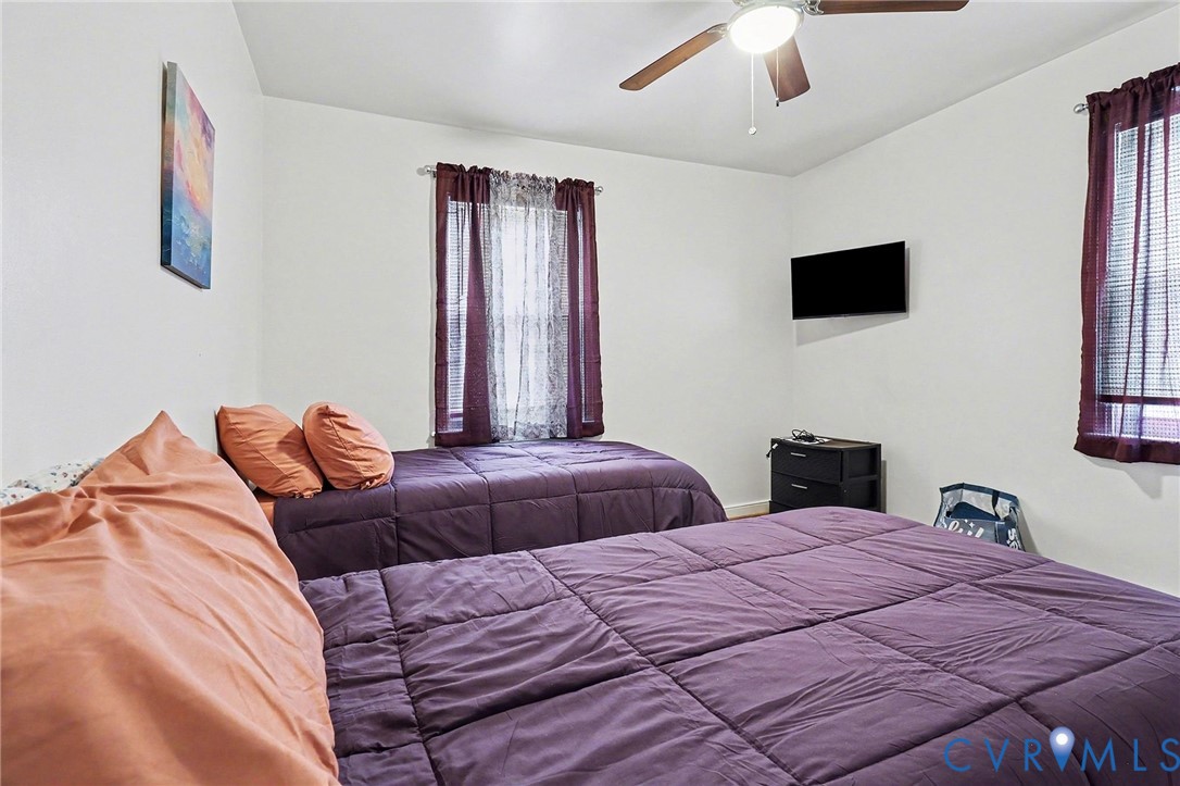 129 Seaboard Street Petersburg, VA 23803 - Photo 12 of 21 a bedroom with a bed and a flat screen tv