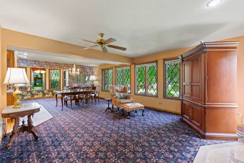 a view of a dining room with furniture and window