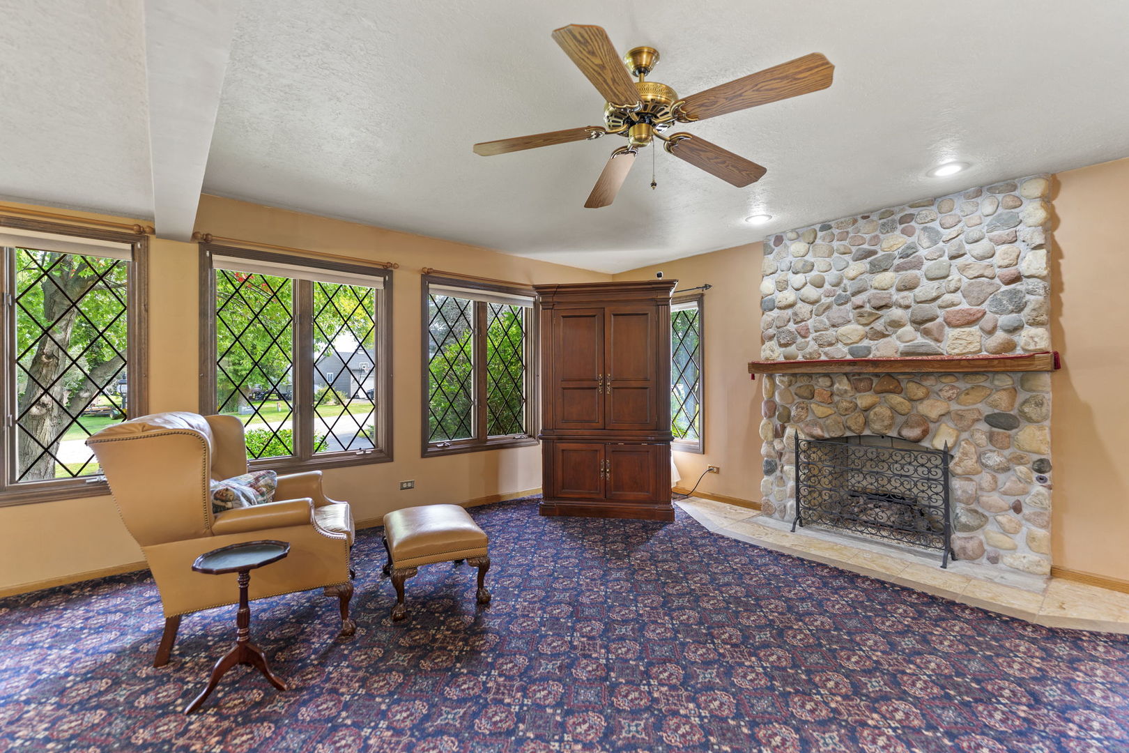 4511 Hanover Drive Crystal Lake, IL 60012 - Photo 12 of 68 a living room with furniture and a fireplace