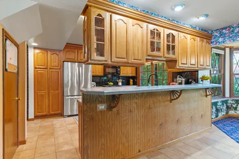a kitchen with a sink and large window