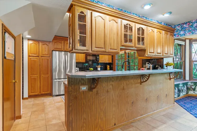 a kitchen with a sink and large window