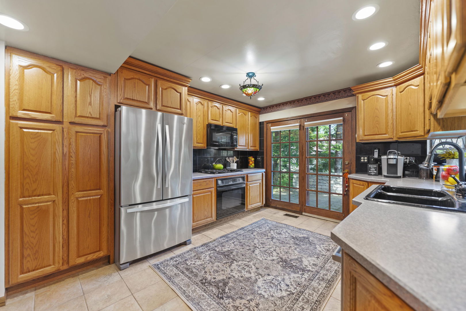 4511 Hanover Drive Crystal Lake, IL 60012 - Photo 20 of 68 a kitchen with stainless steel appliances granite countertop a refrigerator stove top oven and sink