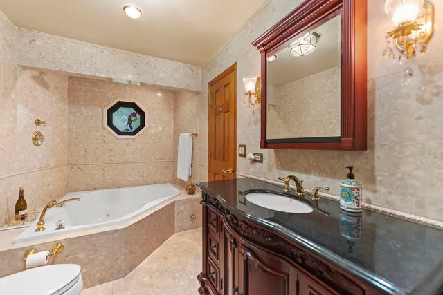 an empty room with closet and ceiling fan