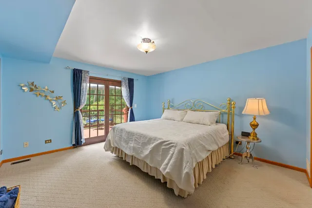 a view of a hallway with workspace and windows