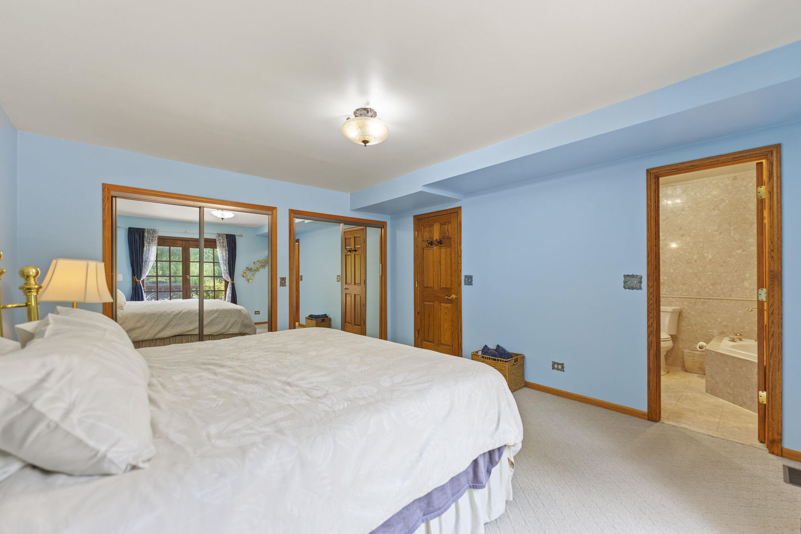 4511 Hanover Drive Crystal Lake, IL 60012 - Photo 27 of 68 a bedroom with a large bed and a large window