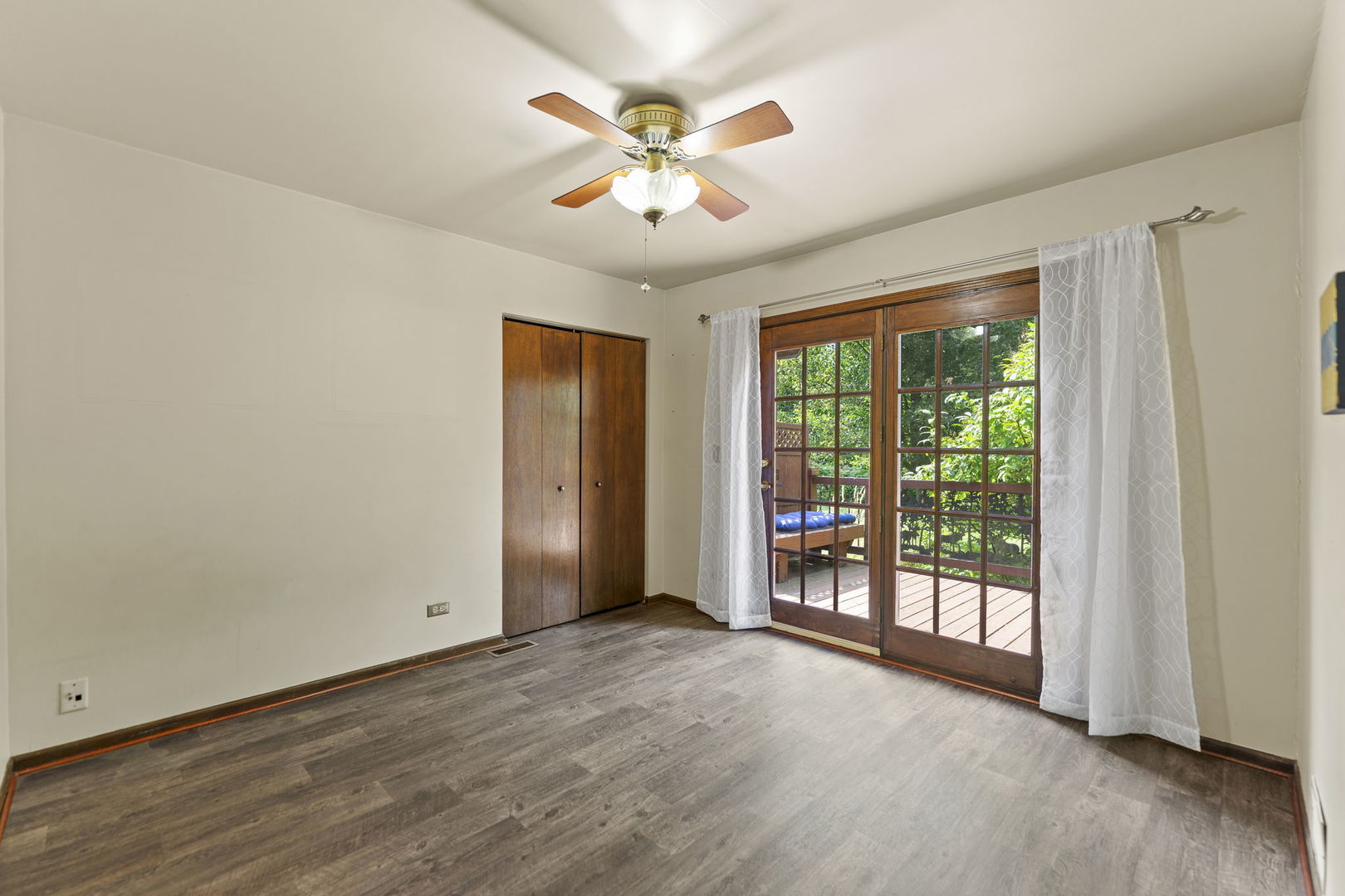 4511 Hanover Drive Crystal Lake, IL 60012 - Photo 28 of 68 an empty room with wooden floor and ceiling fan