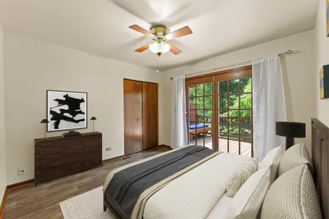 a bedroom with a bed and a potted plant