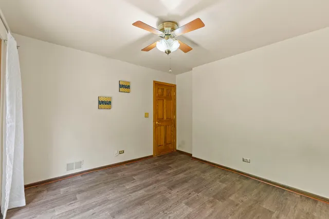 a bed room with a bed and a window