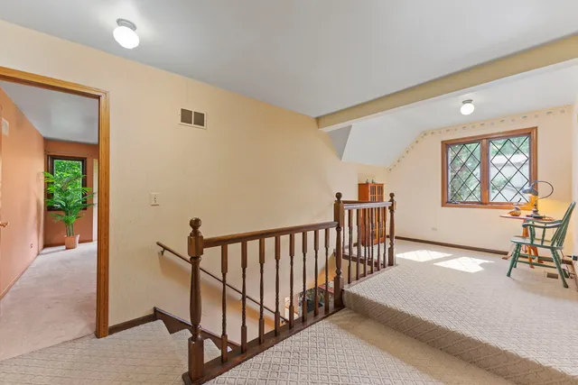 a view of a livingroom with furniture and a potted plant