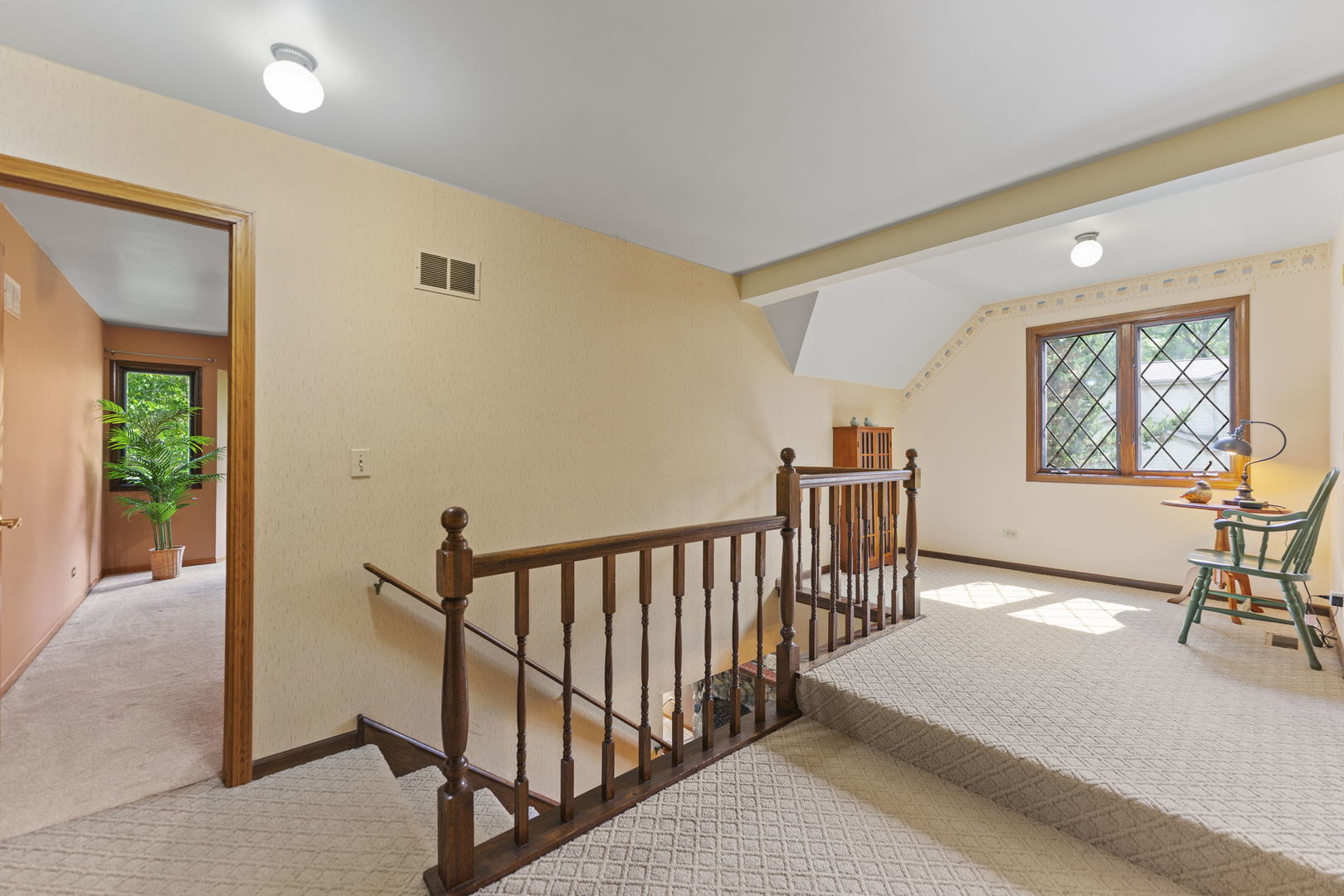 4511 Hanover Drive Crystal Lake, IL 60012 - Photo 31 of 68 a view of a hallway with workspace and windows