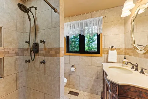 a spacious bedroom with a bed and a window