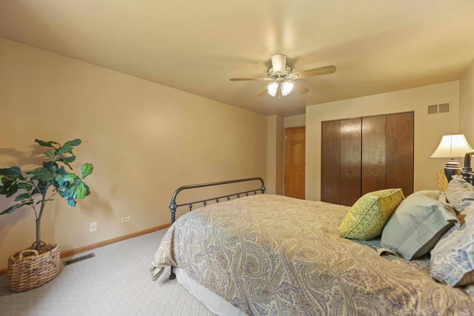 4511 Hanover Drive Crystal Lake, IL 60012 - Photo 34 of 68 a bedroom with a bed and a potted plant