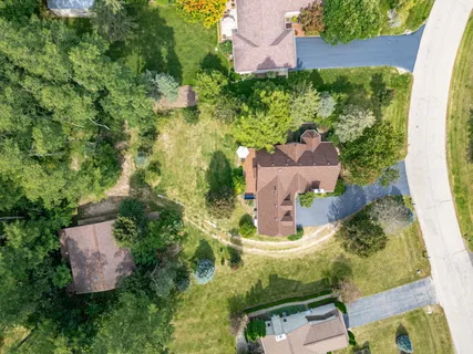 an aerial view of residential house with outdoor space