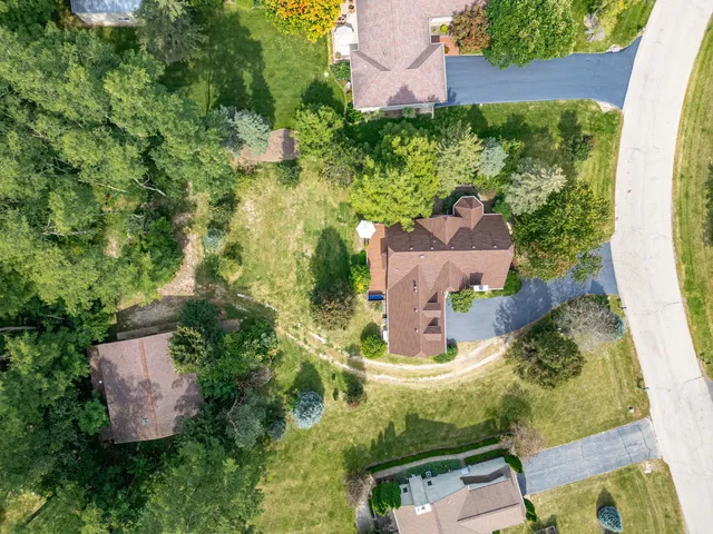 an aerial view of residential house with outdoor space