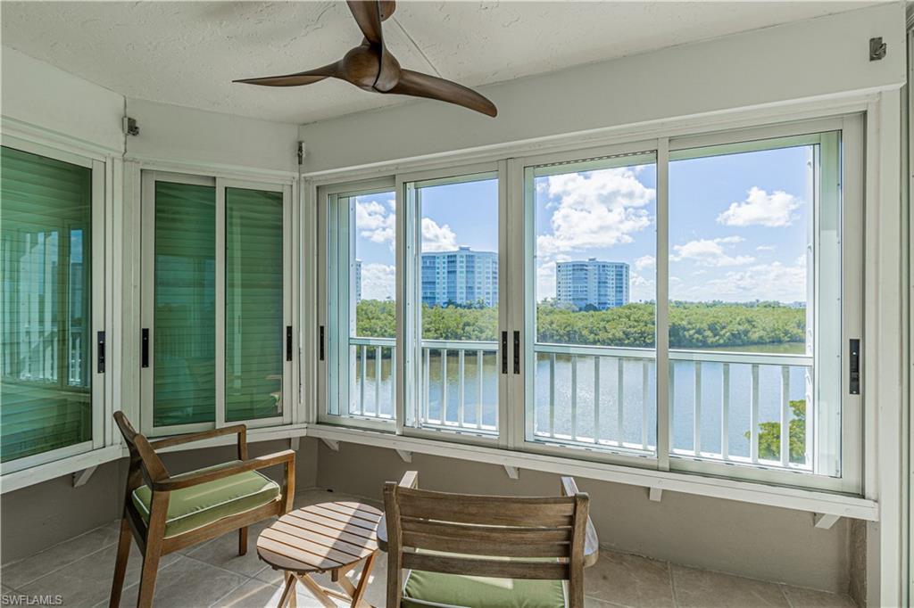 25 Bluebill Avenue, Unit 301 Naples, FL 34108 - Photo 22 of 41 a bathroom with a large window and a bathtub