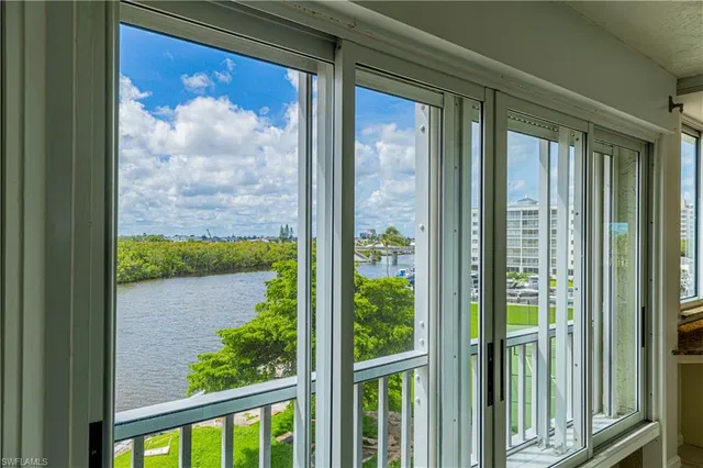 a view of a glass door and chair