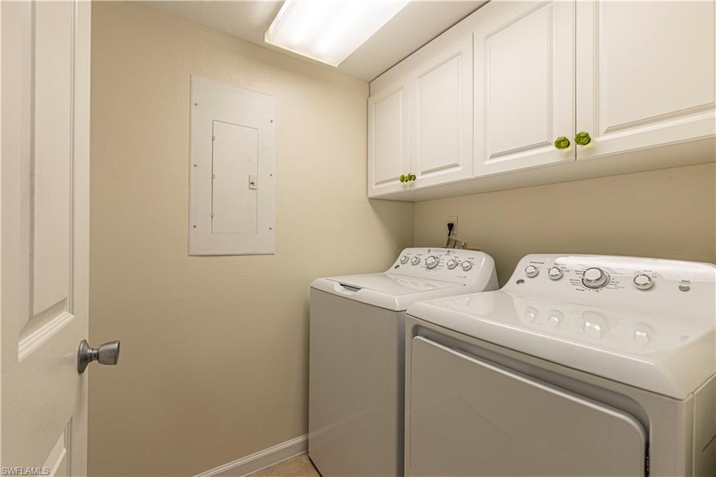 25 Bluebill Avenue, Unit 301 Naples, FL 34108 - Photo 30 of 41 a utility room with dryer and washer