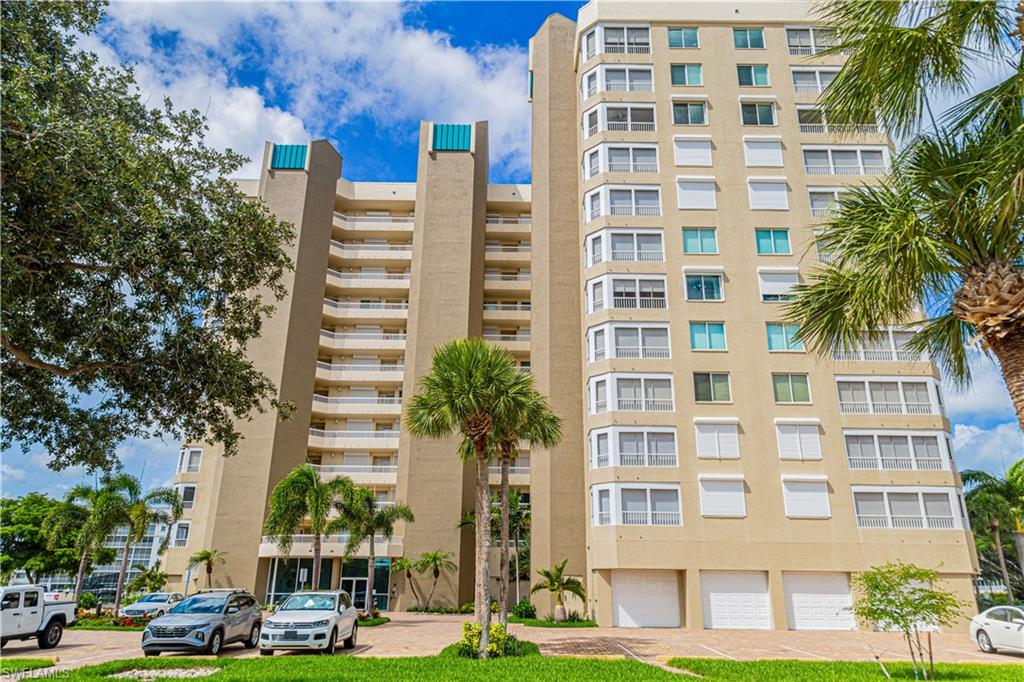 25 Bluebill Avenue, Unit 301 Naples, FL 34108 - Photo 34 of 41 a front view of a multi story building