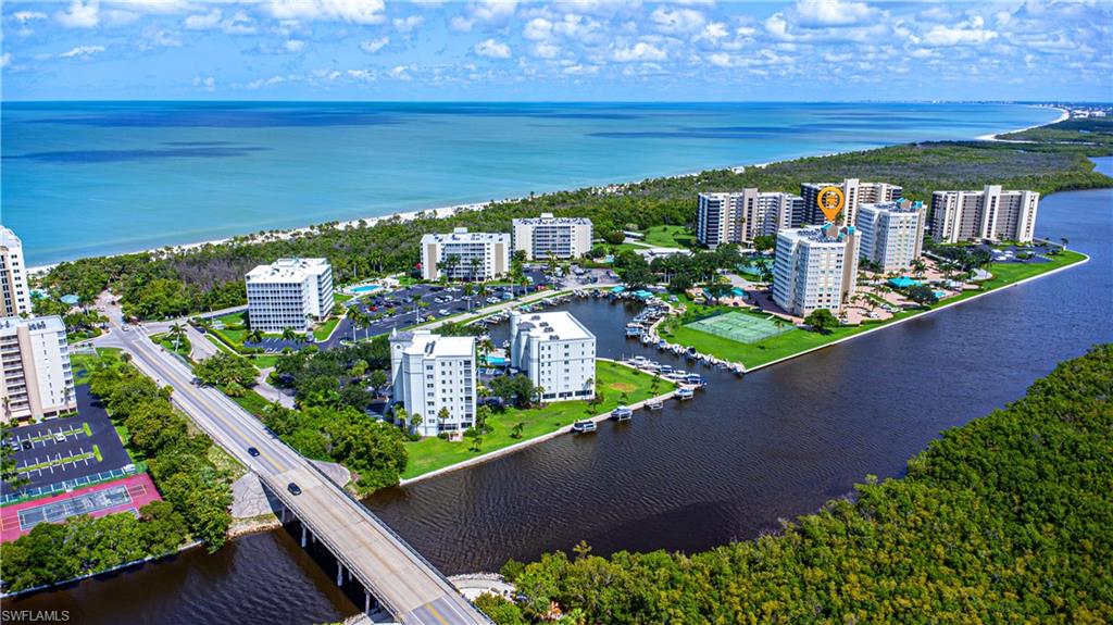 25 Bluebill Avenue, Unit 301 Naples, FL 34108 - Photo 38 of 41 a view of a balcony with wooden floor