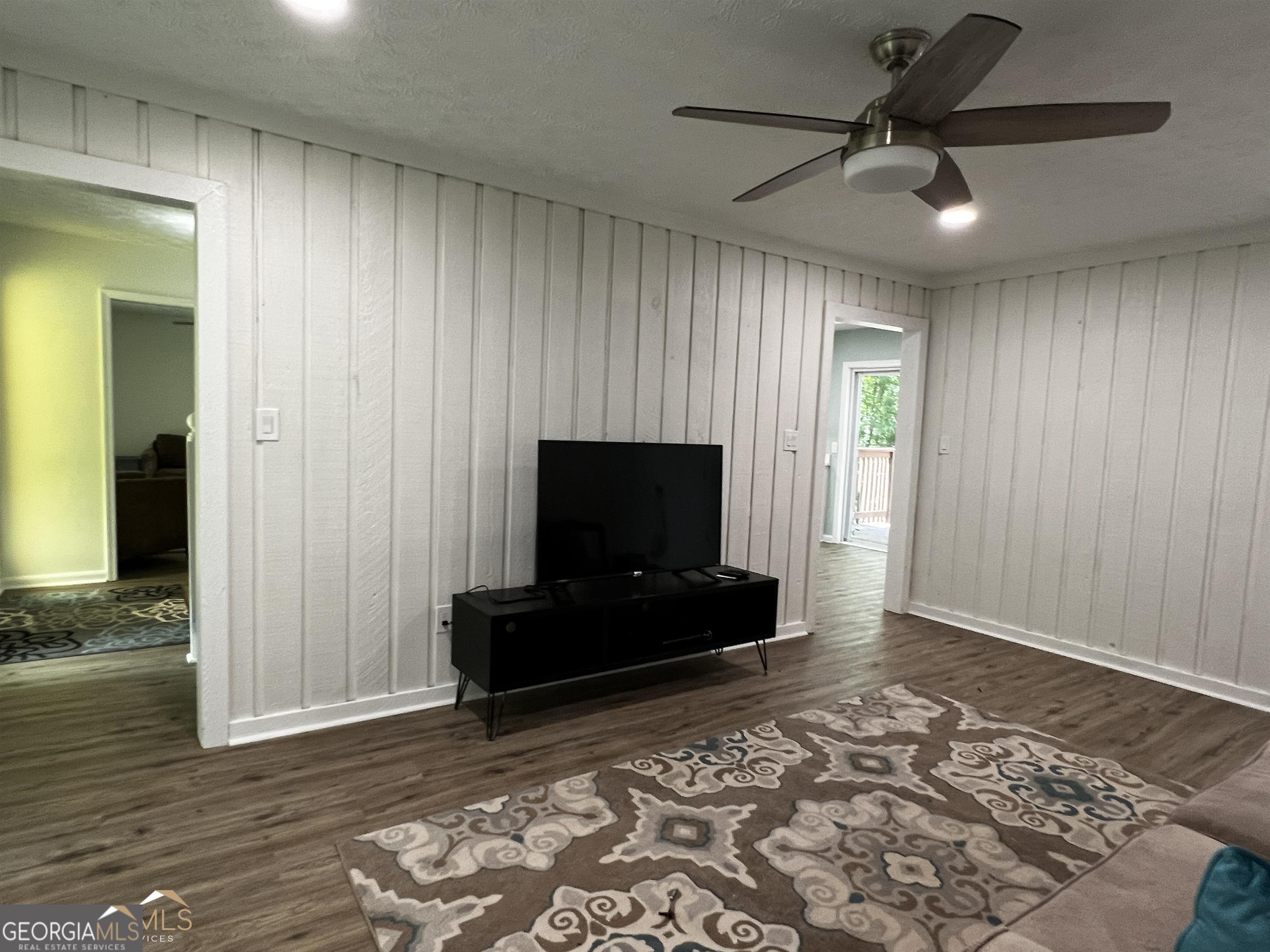 208 Swanson Ridge Peachtree City, GA 30269 - Photo 25 of 40 a living room with furniture and a flat screen tv