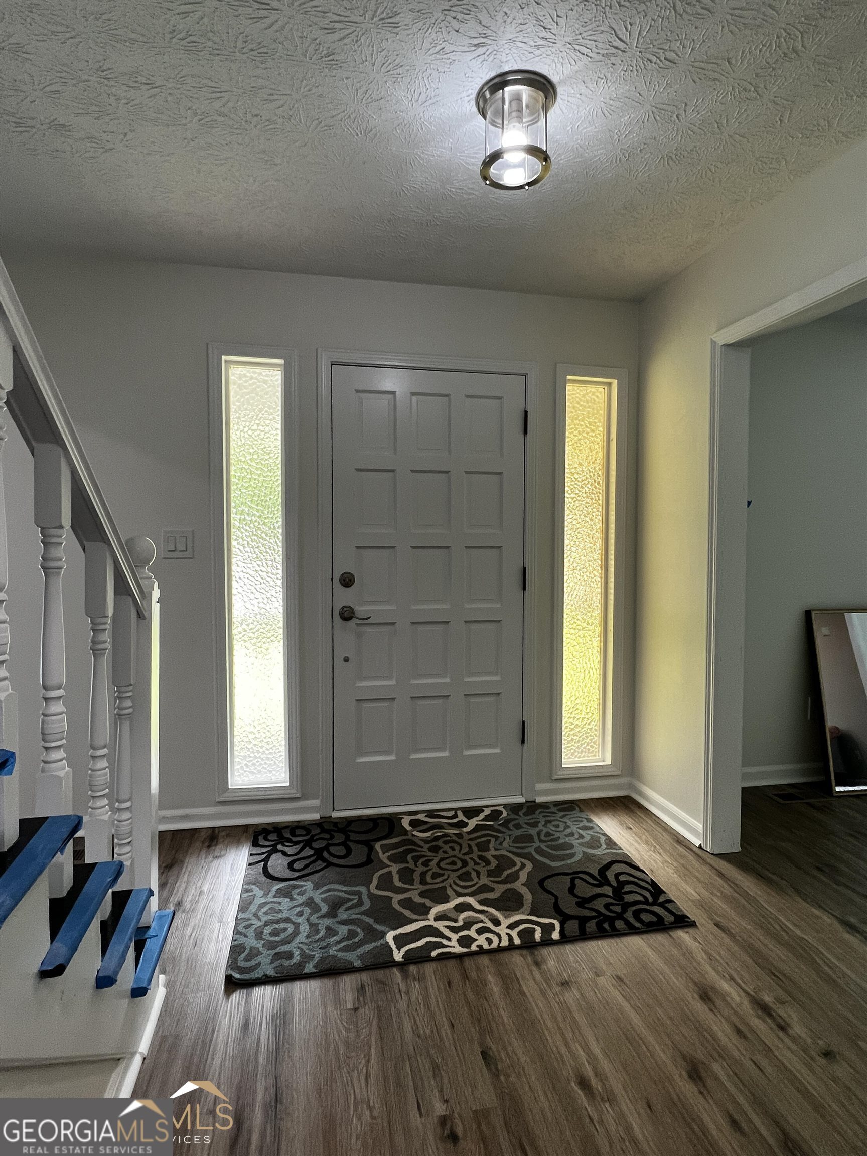 208 Swanson Ridge Peachtree City, GA 30269 - Photo 39 of 40 a view of a livingroom with wooden floor and lounge chair