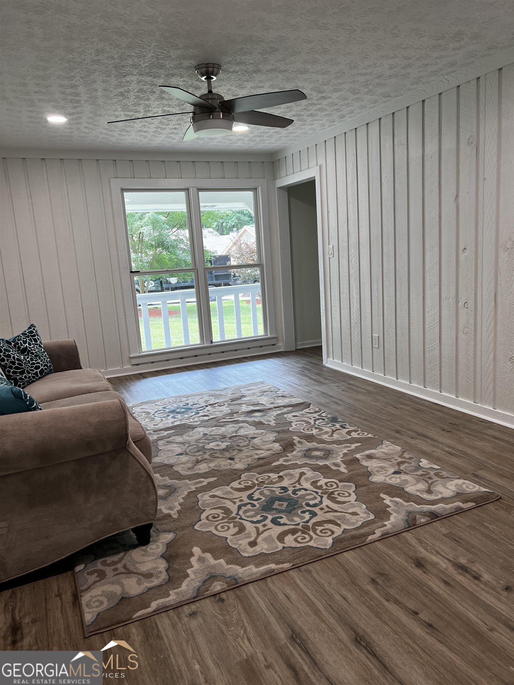 208 Swanson Ridge Peachtree City, GA 30269 - Photo 40 of 40 a living room with a bed furniture and a large window