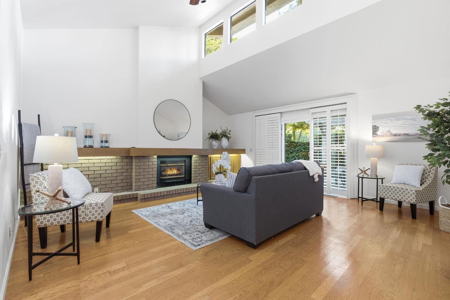 1833 Edgebrook Drive, Unit A Modesto, CA 95354 - Photo 11 of 43 a living room with furniture and a fireplace