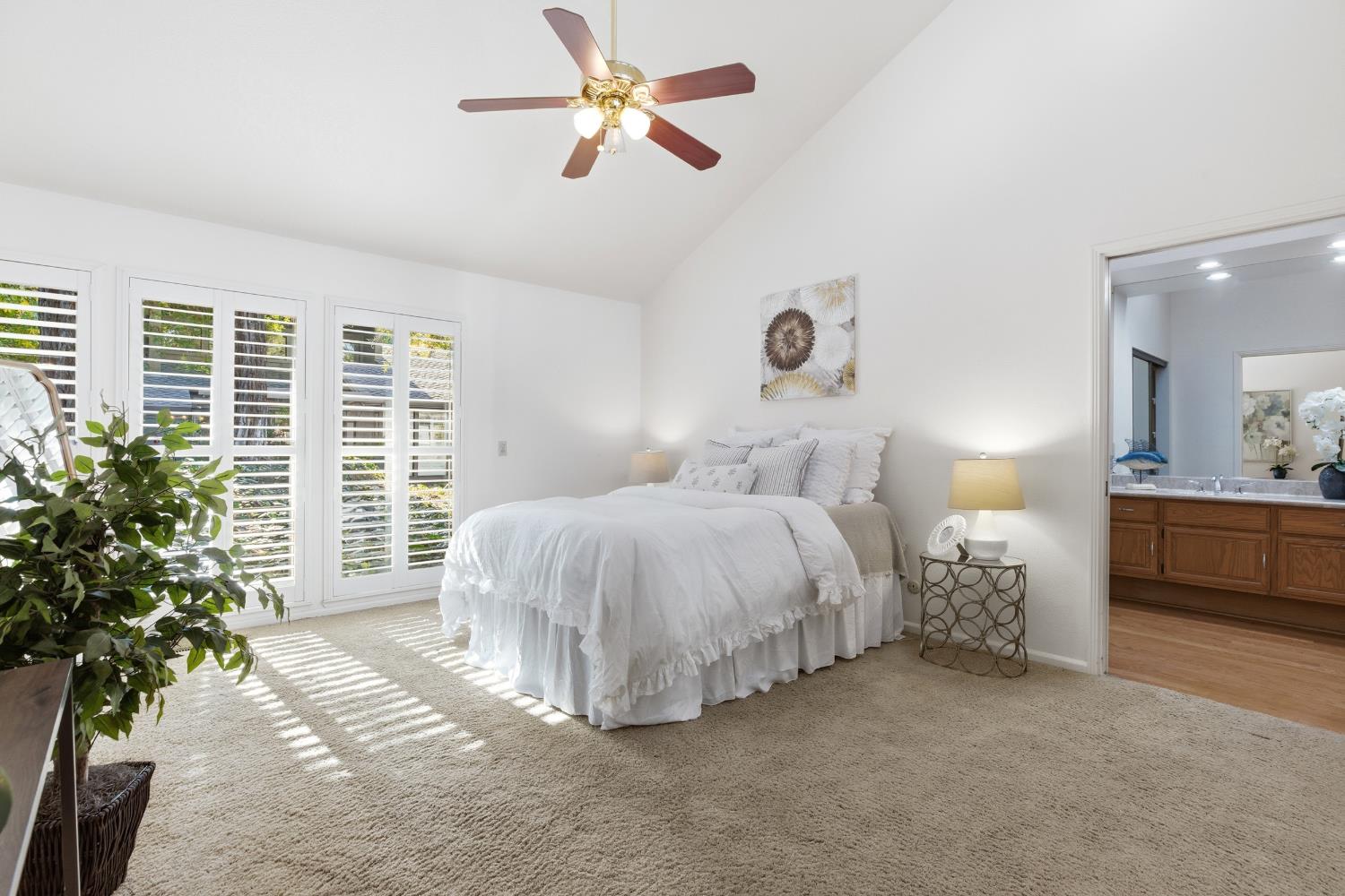 1833 Edgebrook Drive, Unit A Modesto, CA 95354 - Photo 25 of 43 a bed room with a bed and a chandelier